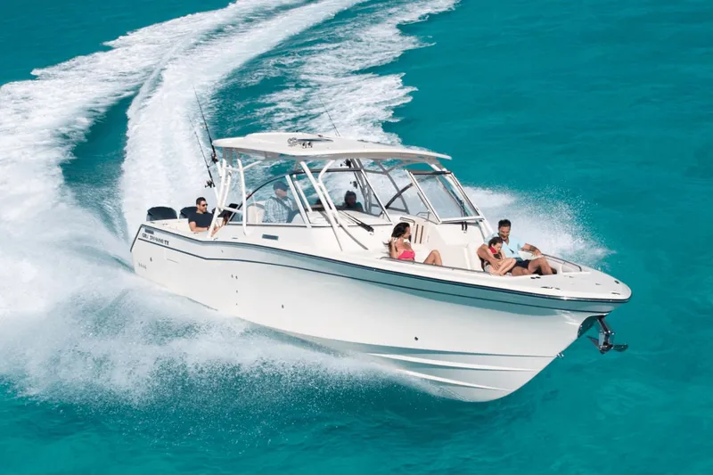 Slide: The Image of 2026 Grady-White Freedom 325 boat in harbor. - 0
