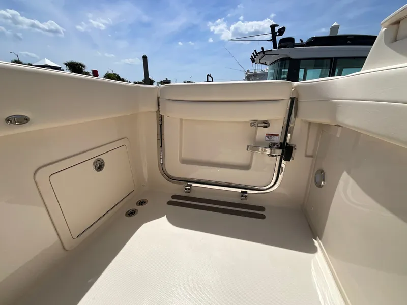Slide: The Image of Grady-White Freedom 325 boat, 2026 model, interior view in sunny weather. - 21