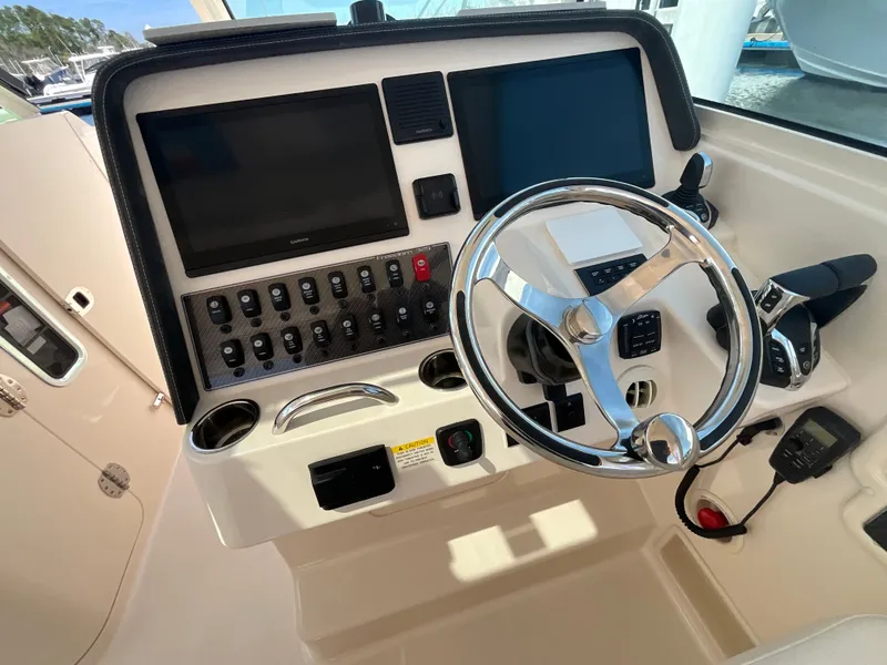 Slide: The Image of Helm console of Grady-White Freedom 325, model year 2026. - 22