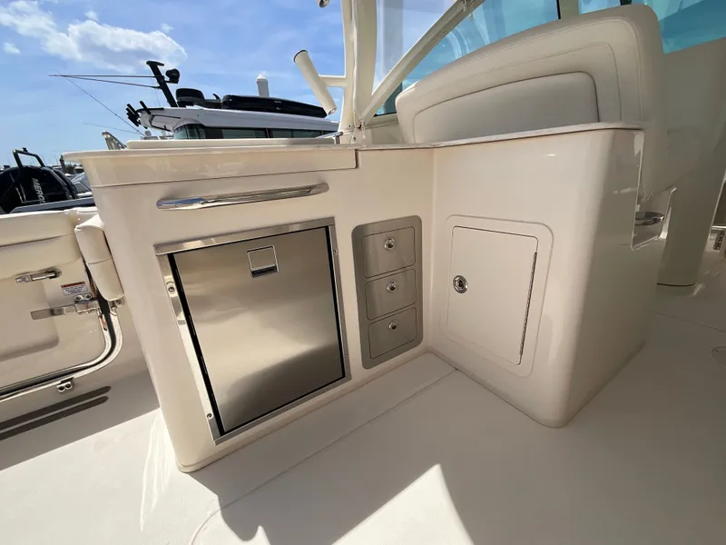 Slide: The Image of Interior of 2026 Grady-White Freedom 325 with storage and drawers. - 24