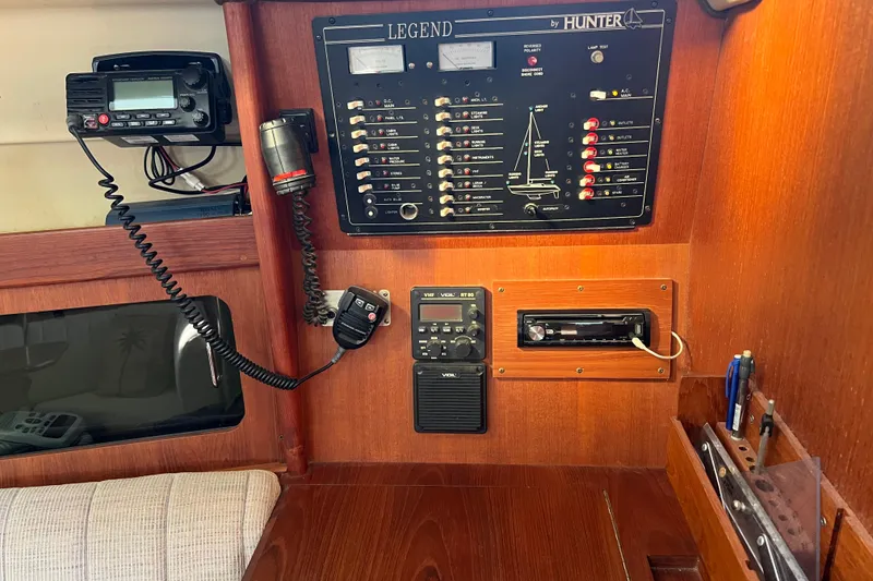 Slide: The Image of Control panel of a 1990 Hunter Legend 35.5 sailboat with communication equipment. - 11