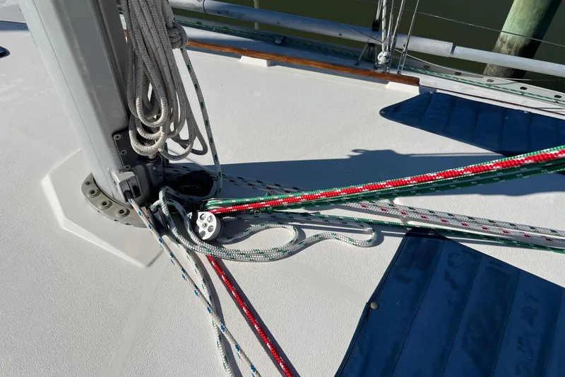 Slide: The Image of Deck of 1990 Hunter Legend 35.5 sailboat with ropes and rigging details. - 13