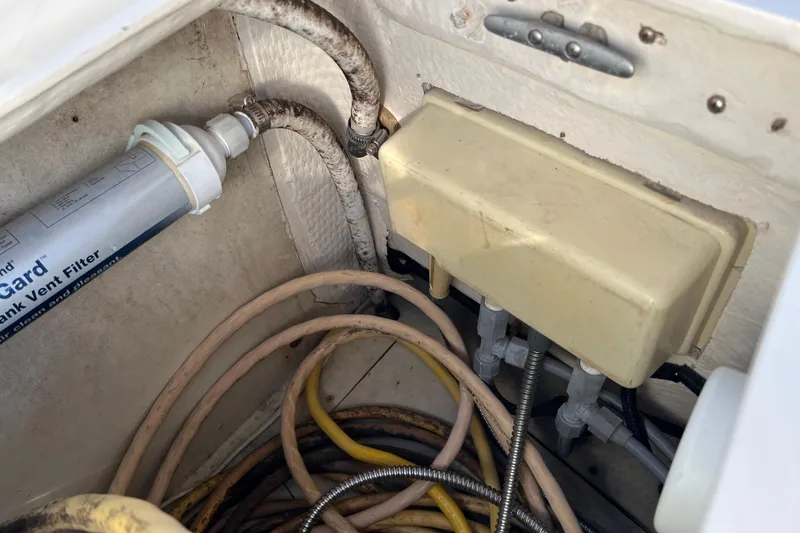 Slide: The Image of Boat plumbing system with filter and cables in a 1990 Hunter Legend 35.5. - 17