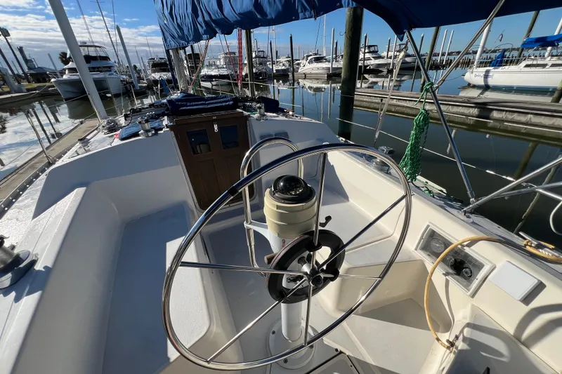 Slide: The Image of Cockpit view of 1990 Hunter Legend 35.5 sailboat docked at marina. - 19
