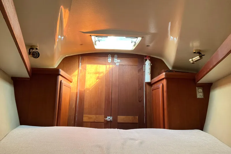Slide: The Image of Cozy cabin interior of 1990 Hunter Legend 35.5 sailboat with wooden finish and skylight. - 28