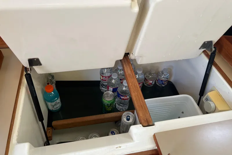 Slide: The Image of Storage compartment with drinks in a 1990 Hunter Legend 35.5 sailboat. - 33