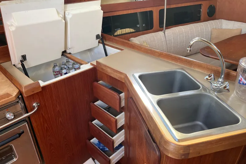 Slide: The Image of Interior of 1990 Hunter Legend 35.5 yacht kitchen with double sink and storage. - 8