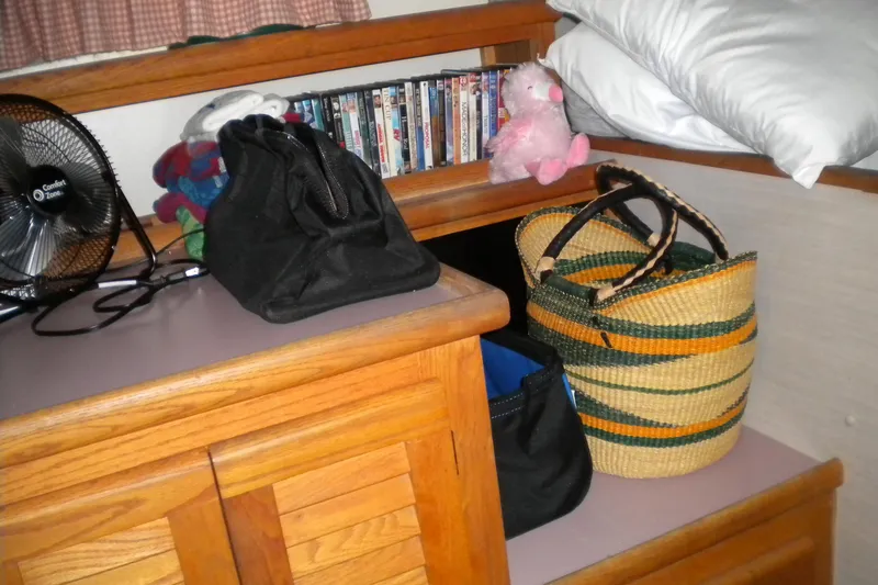 Slide: The Image of 1988 Mainship 40 Double Cabin interior with fan, bags, and plush toy. - 14