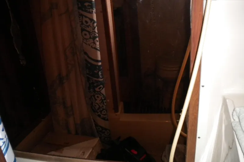 Slide: The Image of Bathroom interior of 1988 Mainship 40 Double Cabin with shower and curtain. - 17
