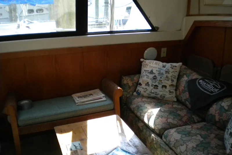 Slide: The Image of Interior of 1988 Mainship 40 Double Cabin with floral sofa and nautical decor. - 21