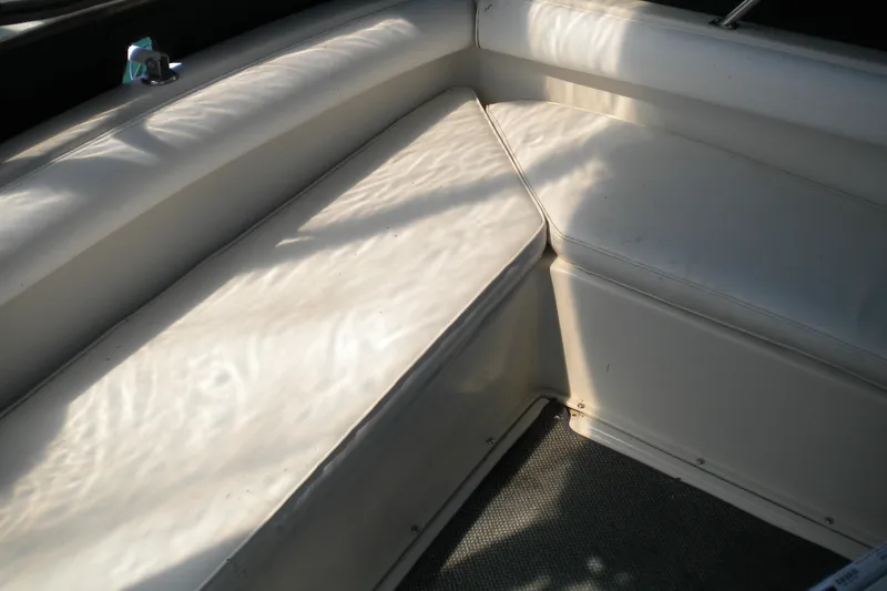 Slide: The Image of 1988 Mainship 40 Double Cabin interior seating with white upholstery. - 22