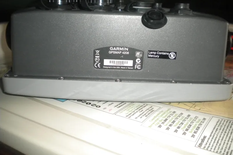Slide: The Image of Garmin GPSMAP 4208 device on Mainship 40 Double Cabin, 1988 model, with mercury lamp warning. - 38