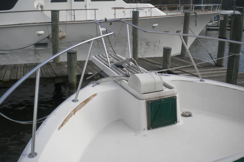 Slide: The Image of 1988 Mainship 40 Double Cabin yacht bow with anchor, docked at marina. - 42