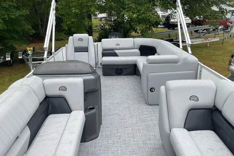 Slide: The Image of 2026 Sun Tracker PB 20 DLX pontoon boat with spacious seating and modern design. - 9