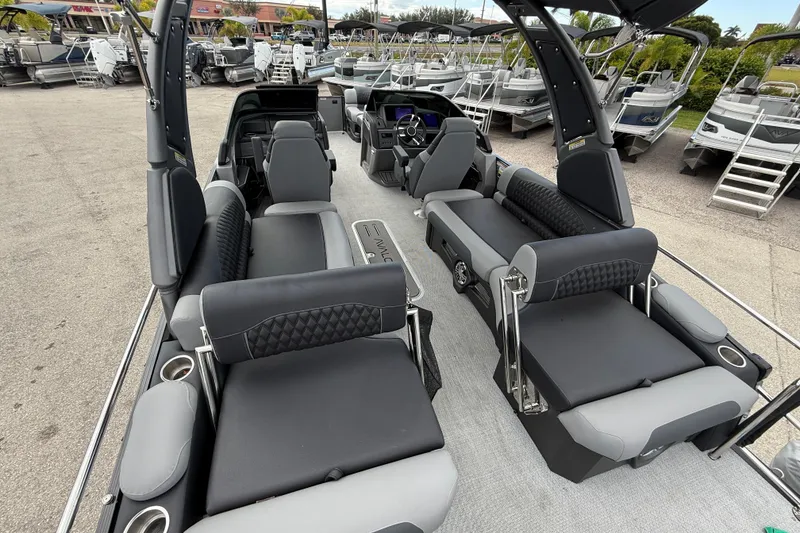 Slide: The Image of Luxurious 2026 Avalon 2585 Excalibur LTD boat with quad lounger seating and high-performance features. - 10