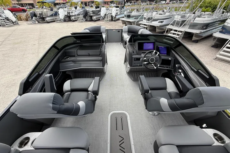 Slide: The Image of Luxurious 2026 Avalon 2585 Excalibur LTD boat interior with quad lounger seating and modern dashboard. - 12