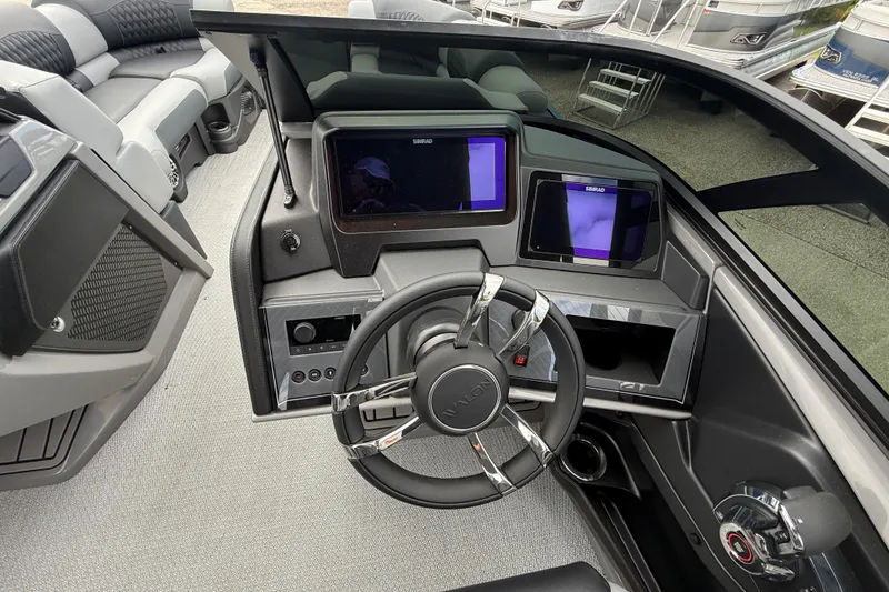 Slide: The Image of 2026 Avalon 2585 Excalibur LTD boat dashboard with advanced controls and displays. - 20