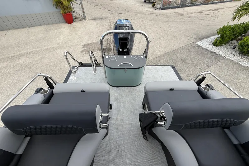 Slide: The Image of 2026 Avalon 2585 Excalibur LTD boat interior with quad lounger and high-performance features. - 23