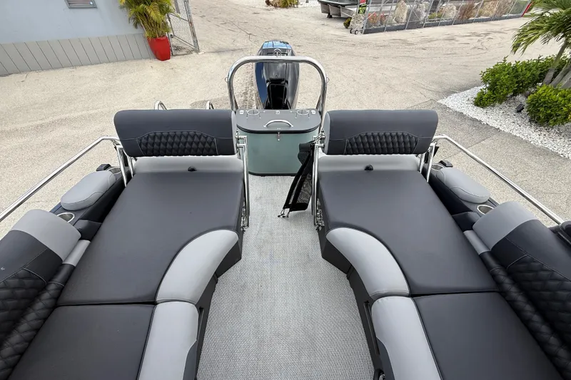 Slide: The Image of 2026 Avalon 2585 Excalibur LTD boat interior with quad lounger seating and high-performance features. - 24