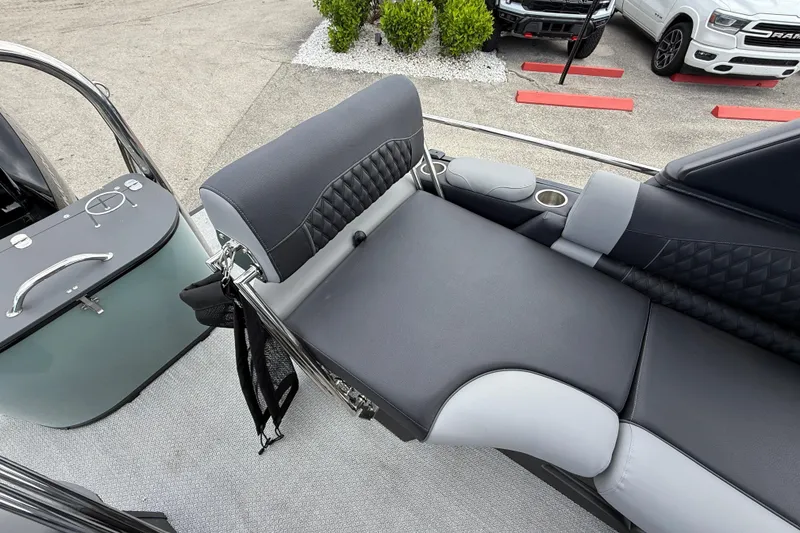 Slide: The Image of Luxurious seating on 2026 Avalon 2585 Excalibur LTD boat, featuring premium upholstery and cup holders. - 25