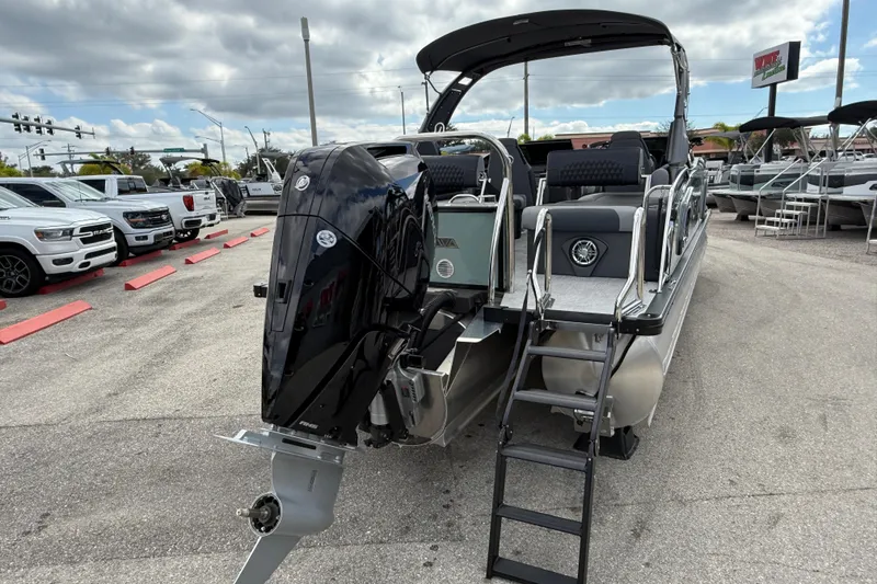Slide: The Image of 2026 Avalon 2585 Excalibur LTD boat with Mercury 400hp V-10 Verado engine, parked outdoors. - 6