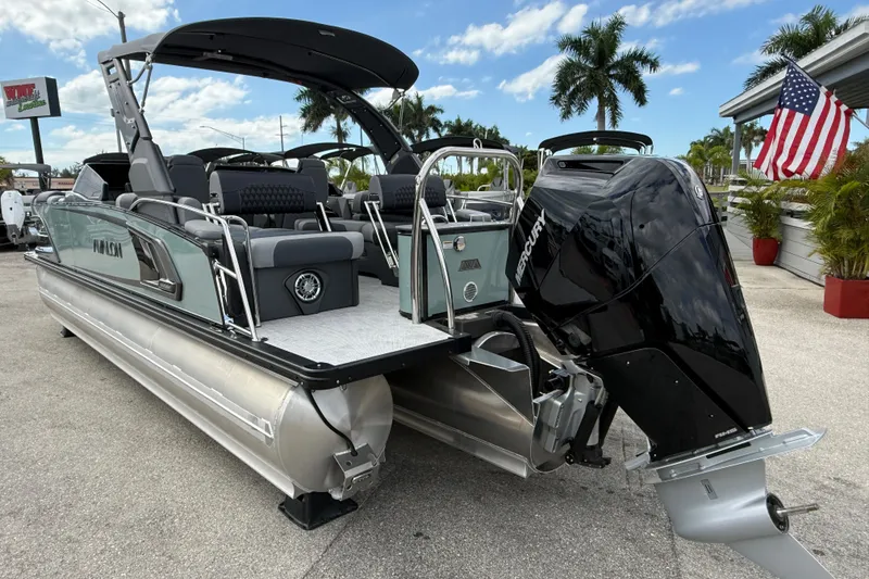 Slide: The Image of 2026 Avalon 2585 Excalibur LTD boat with Mercury 400hp V-10 Verado engine, parked outdoors. - 7