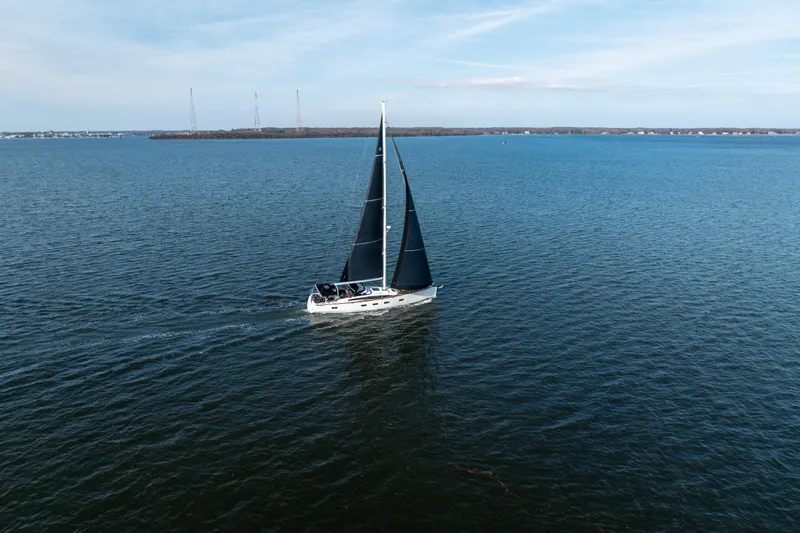 Slide: The Image of Sailing yacht Jeanneau 64 (2016) gliding on open water under clear skies. - 11