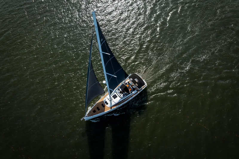 Slide: The Image of Aerial view of 2016 Jeanneau 64 sailboat navigating open waters. - 13