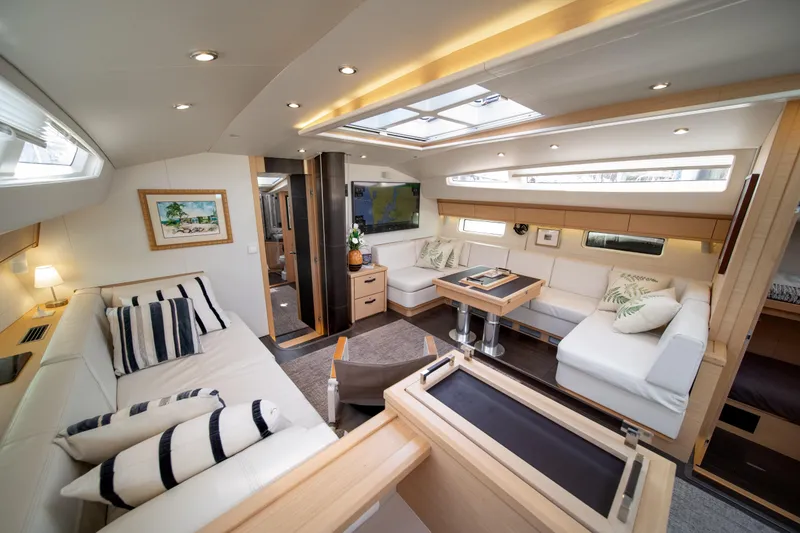 Slide: The Image of Luxurious interior of 2016 Jeanneau 64 yacht with elegant seating and modern decor. - 24