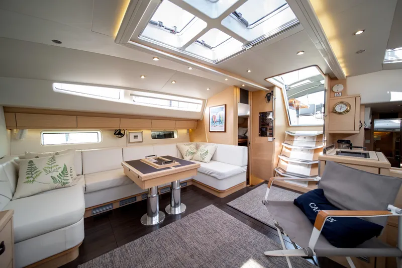 Slide: The Image of Luxurious interior of 2016 Jeanneau 64 yacht with modern furnishings and ample natural light. - 27