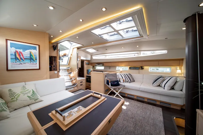Slide: The Image of Luxurious interior of 2016 Jeanneau 64 yacht with modern furnishings and skylights. - 28