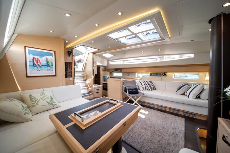 Slide: The Image of Luxurious interior of 2016 Jeanneau 64 yacht with elegant seating and modern decor. - 29