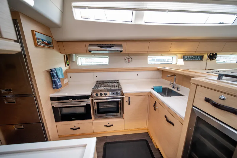 Slide: The Image of Luxurious 2016 Jeanneau 64 yacht kitchen with modern appliances and sleek design. - 30