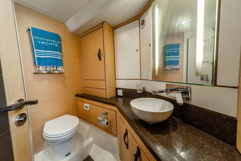 Slide: The Image of Luxurious bathroom in a 2016 Jeanneau 64 yacht with modern fixtures and elegant design. - 39