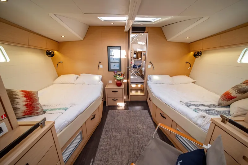 Slide: The Image of Luxurious interior of 2016 Jeanneau 64 yacht with twin beds and modern decor. - 42