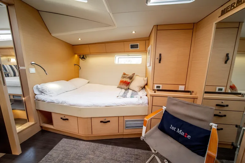 Slide: The Image of Luxurious 2016 Jeanneau 64 yacht cabin with cozy bed and stylish decor. - 43