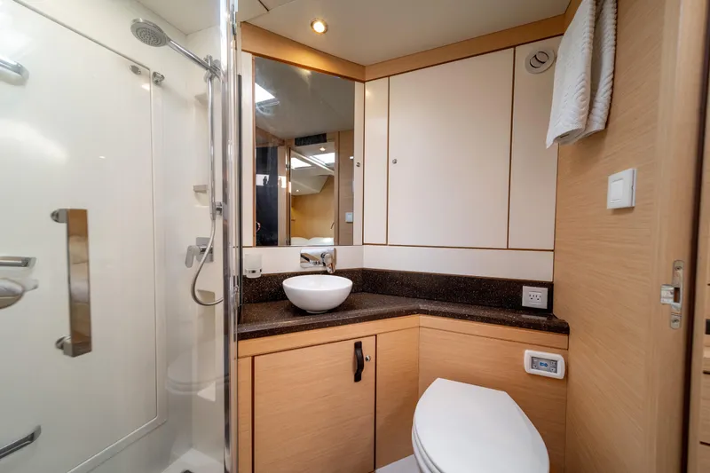Slide: The Image of Luxurious bathroom in a 2016 Jeanneau 64 yacht with modern fixtures and elegant design. - 46