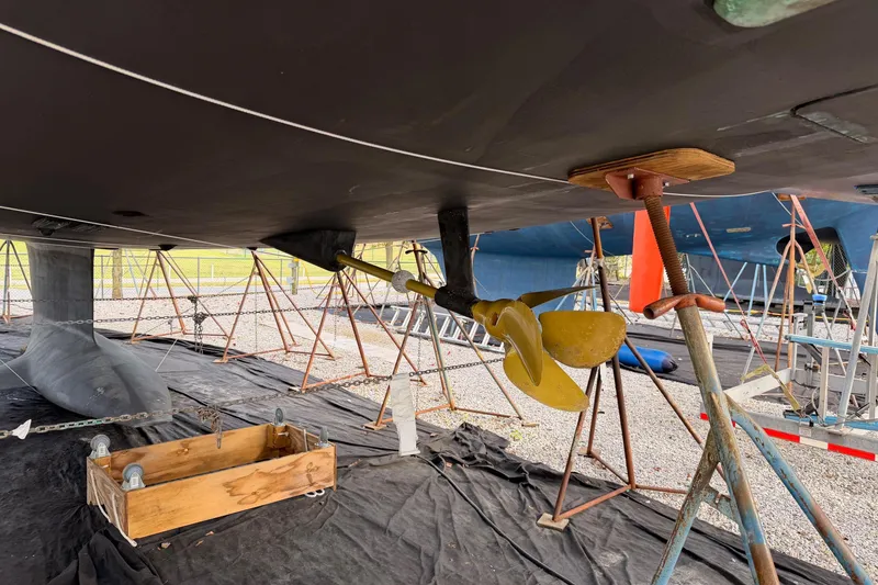 Slide: The Image of Underwater view of 2016 Jeanneau 64 sailboat's propeller and keel in dry dock. - 51