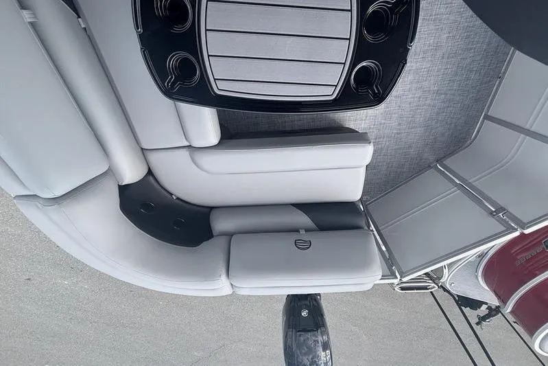 Slide: The Image of 2026 Sun Tracker PB 20 DLX pontoon boat interior with seating and cup holders. - 7