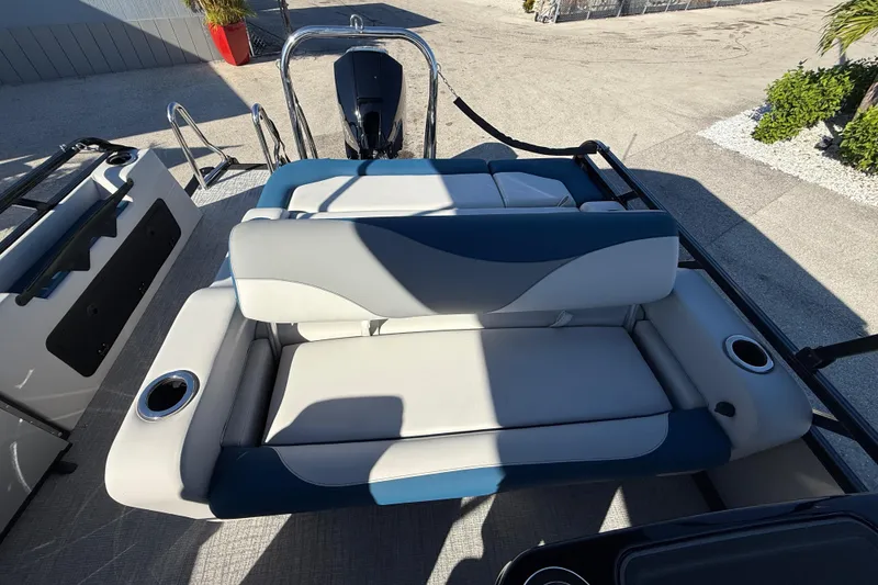 Slide: The Image of 2026 Avalon 2585 LSZ Entertainer boat with stylish seating and cup holders. - 21