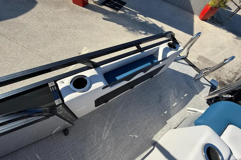 Slide: The Image of 2026 Avalon 2585 LSZ Entertainer boat interior with cup holders and seating. - 22