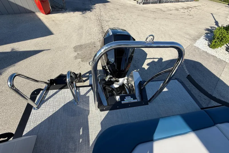 Slide: The Image of 2026 Avalon 2585 LSZ Entertainer boat with chrome railings and motor, viewed from above. - 23