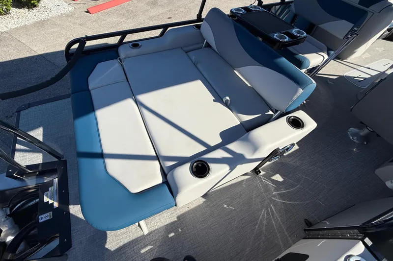 Slide: The Image of 2026 Avalon 2585 LSZ Entertainer boat interior with cushioned seating and cup holders. - 28