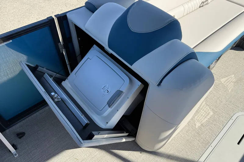 Slide: The Image of 2026 Avalon 2585 LSZ Entertainer boat with open storage compartment and seating. - 30