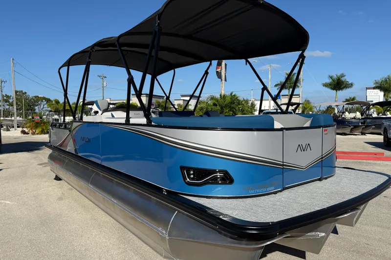 Slide: The Image of 2026 Avalon 2585 LSZ Entertainer Tri Toon boat with blue and silver design. - 5