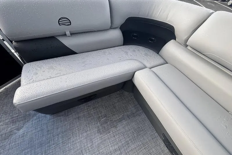 Slide: The Image of 2026 Sun Tracker Party Barge 20 DLX interior with wet gray seating and modern design. - 10