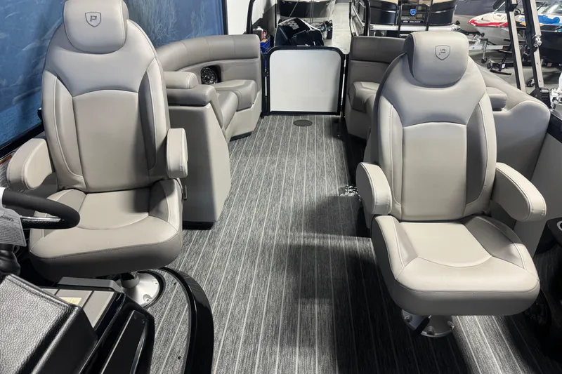 Slide: The Image of Interior of 2026 Premier 230 SunSation RF pontoon boat with luxurious seating. - 11