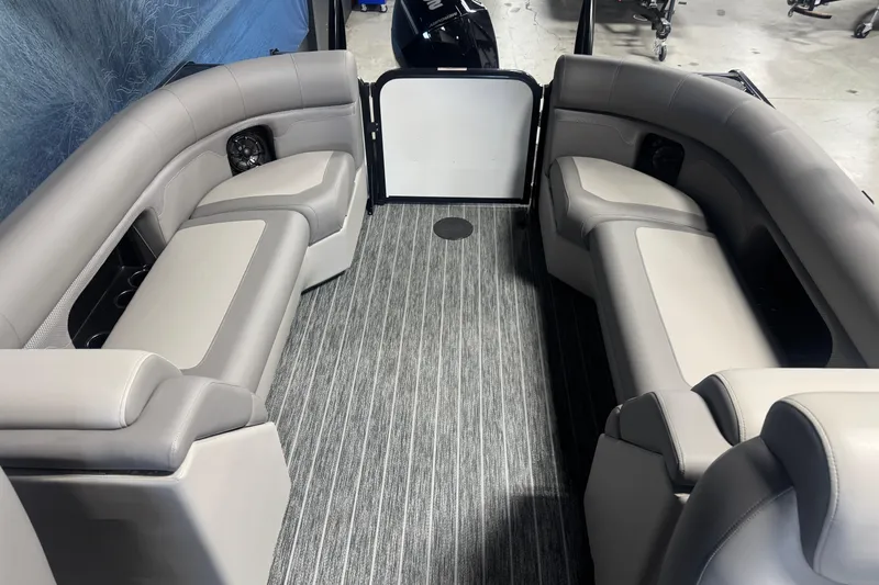 Slide: The Image of 2026 Premier 230 SunSation RF boat interior with gray seating and striped flooring. - 15