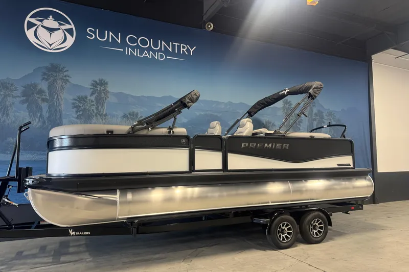 Slide: The Image of 2026 Premier 230 SunSation RF pontoon boat with Mercury outboard motor in showroom. - 4