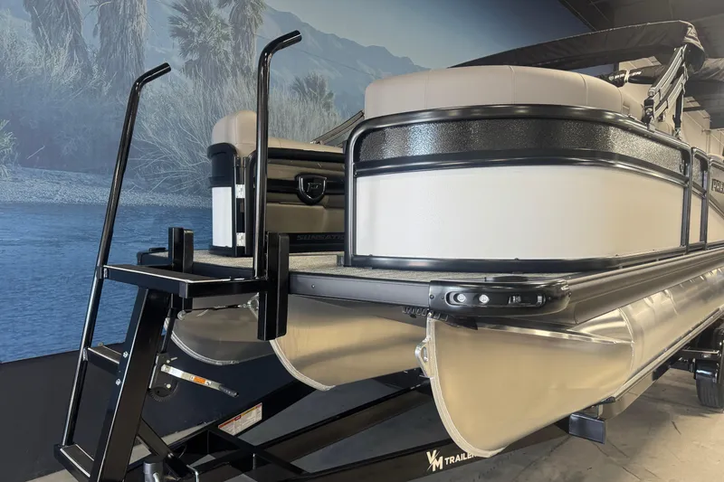 Slide: The Image of 2026 Premier 230 SunSation RF pontoon boat on display with scenic backdrop. - 5